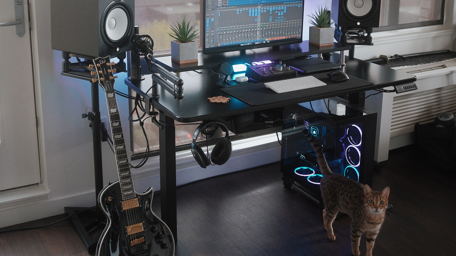 Figured I’d post my workstation while taking a small break from designing the UI elements of my next drum libraries. There are some sneak peeks in there. I used to do all my work on a 2010 MacBook, but having a dedicated workstation for music, UI, programming, and video work makes massive projects manageable. An atmosphere conducive to creativity is important, so I added light bars based on the type of work I’m doing. Thanks to Autonomous for the Autonomous Desk. It’s the home base of it all. I can sit or stand freely and keep it all cable managed very easily.