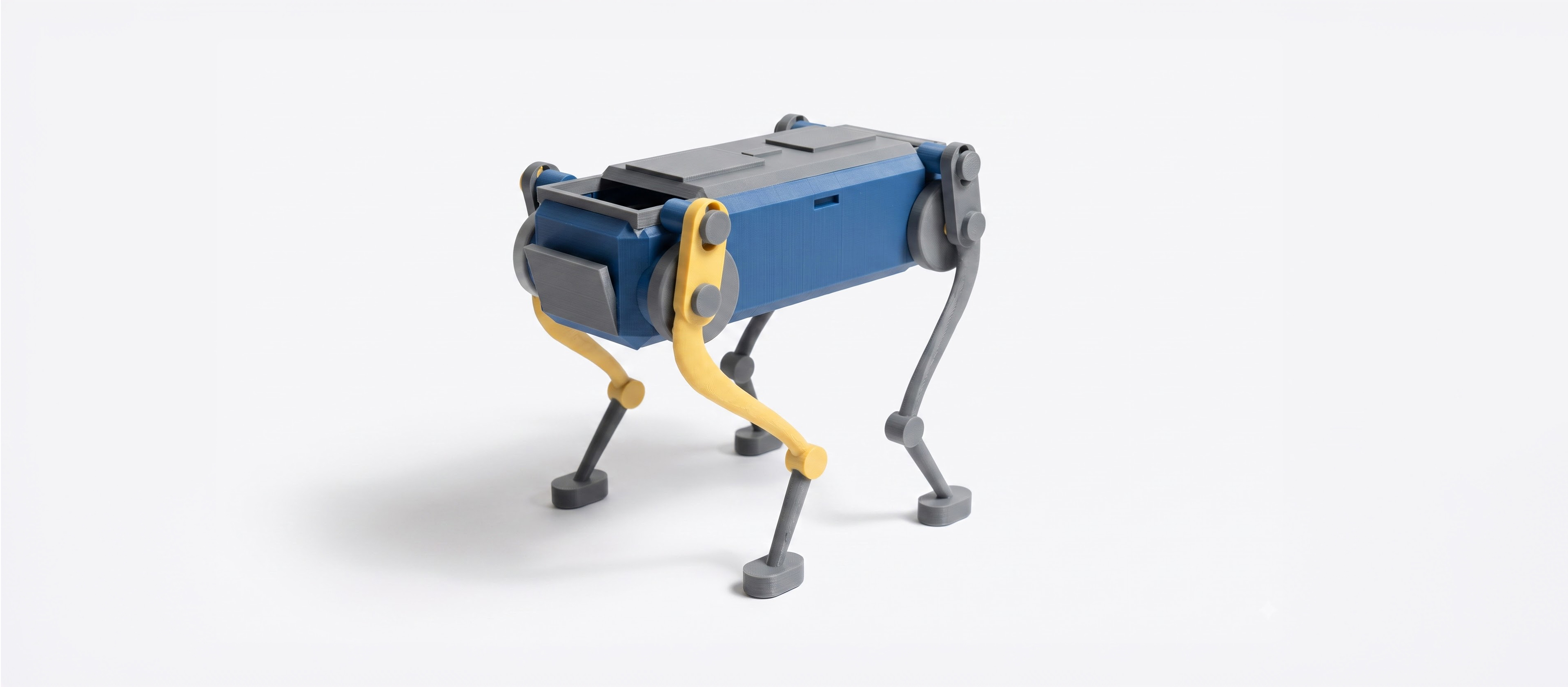 A palm-size wind-up walker. Twist the knob at the back to wind it up, set it down, and it trots forward on four legs with a smooth, life-like gait - no batteries, no motors. The rubber band inside drives two crankshafts that swing the legs in turn, so it keeps its balance step after step. Every part is 3D printed. (1 of 1)