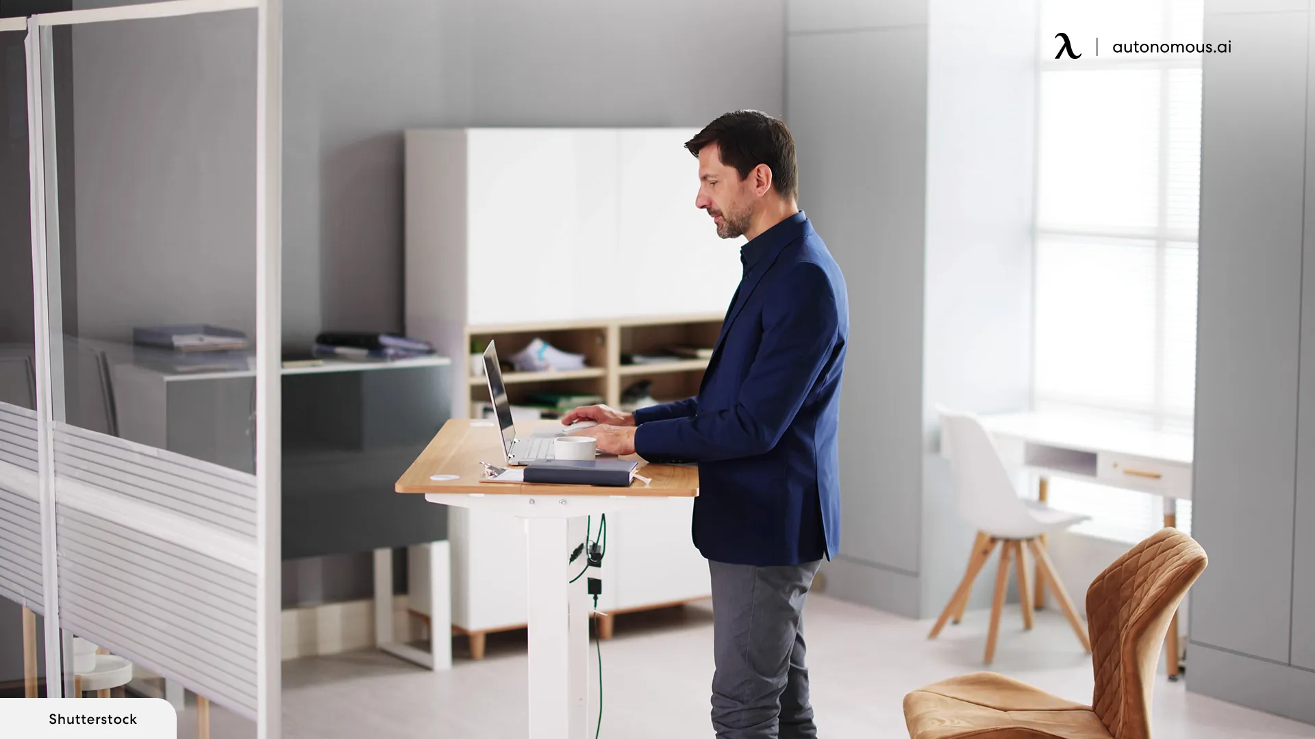 What are the health benefits of using a tall office desk for standing?