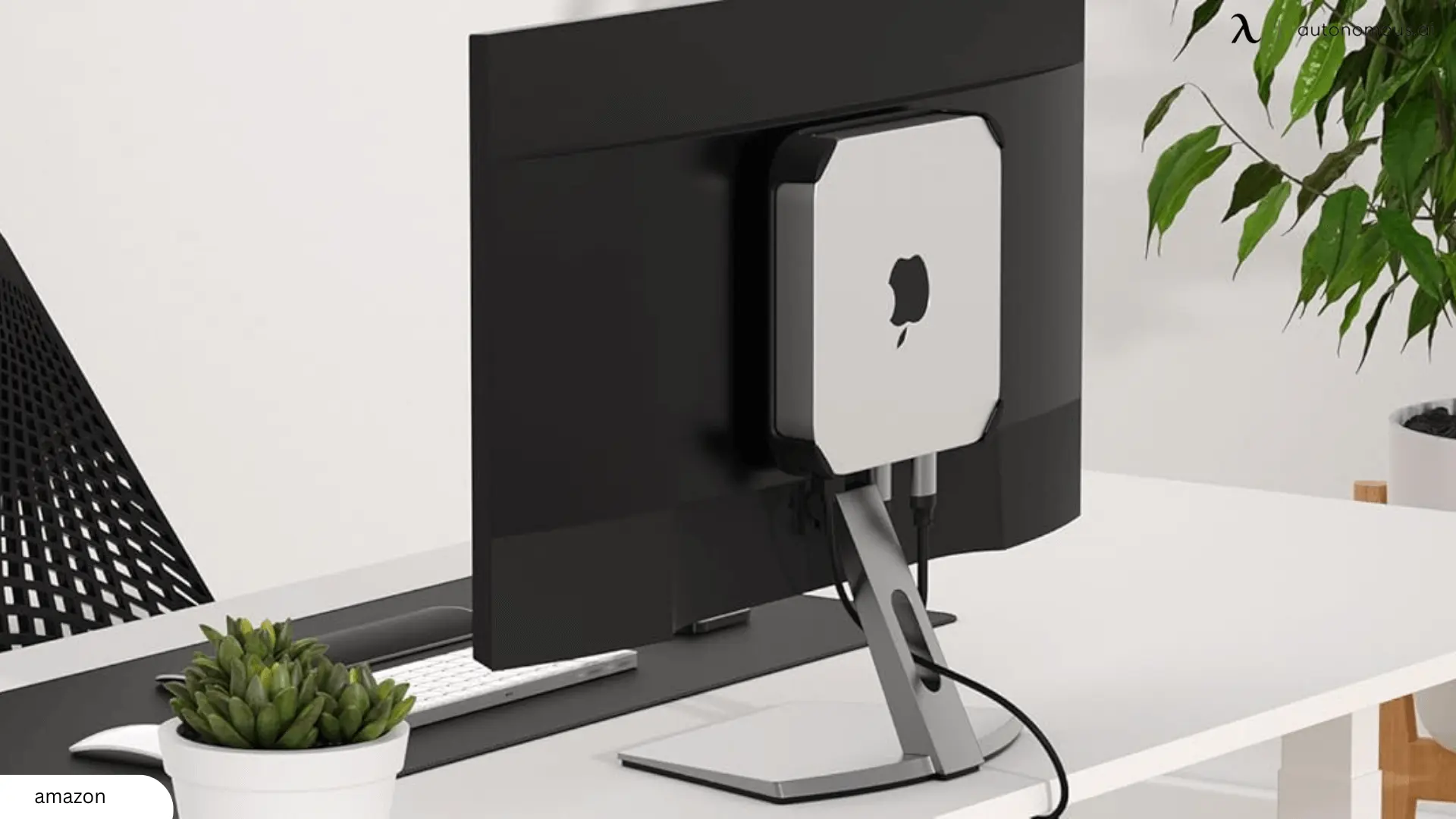 Another creative way to hide your Mac Mini is by attaching it behind your monitor