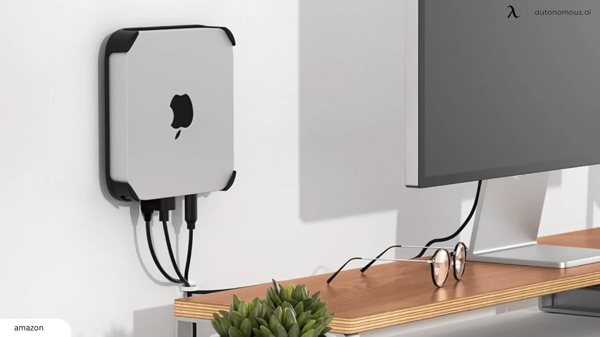 By placing your Mac Mini on the wall near your desk