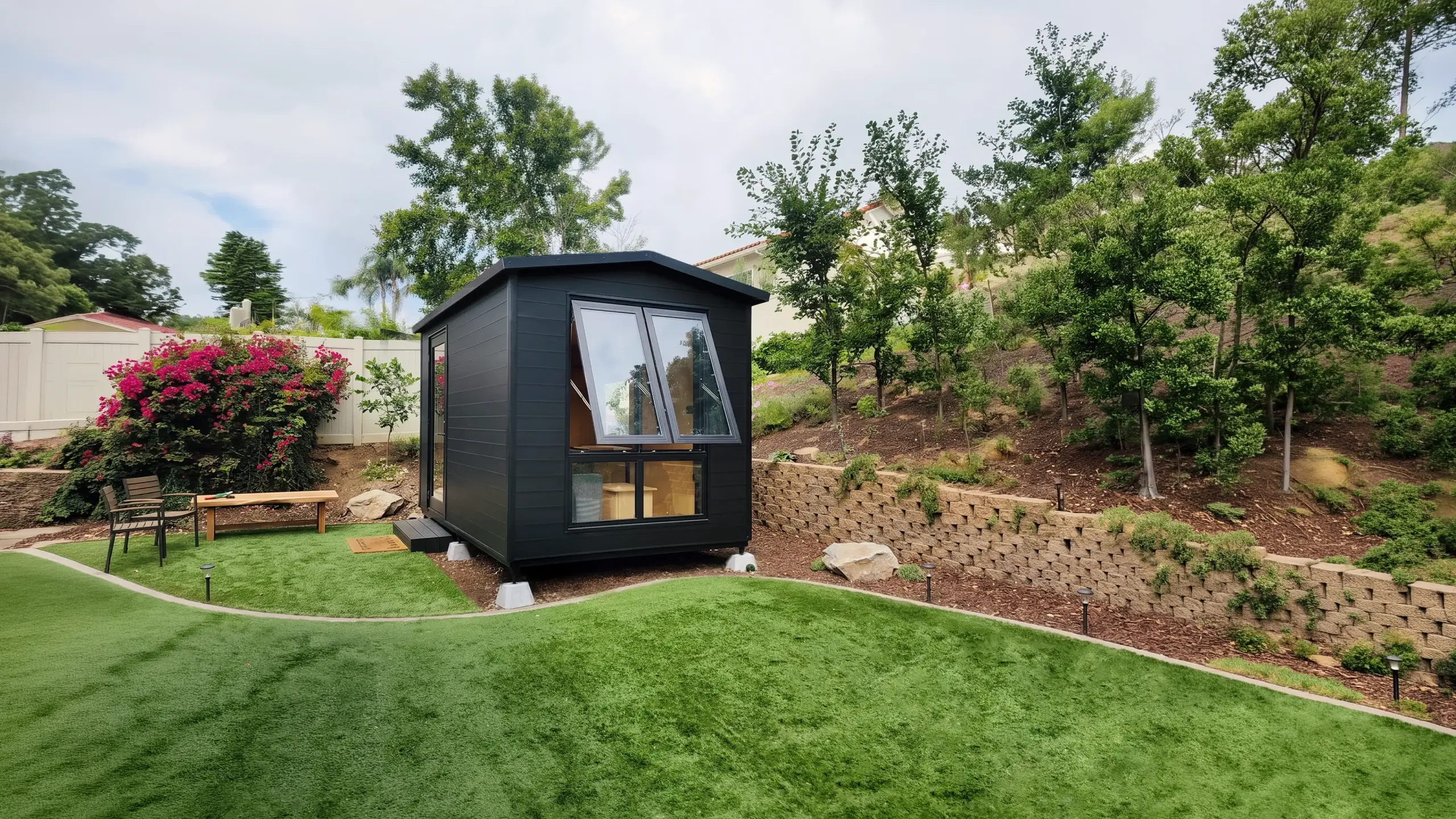 StudioPod installed on concrete footings in a landscaped backyard
