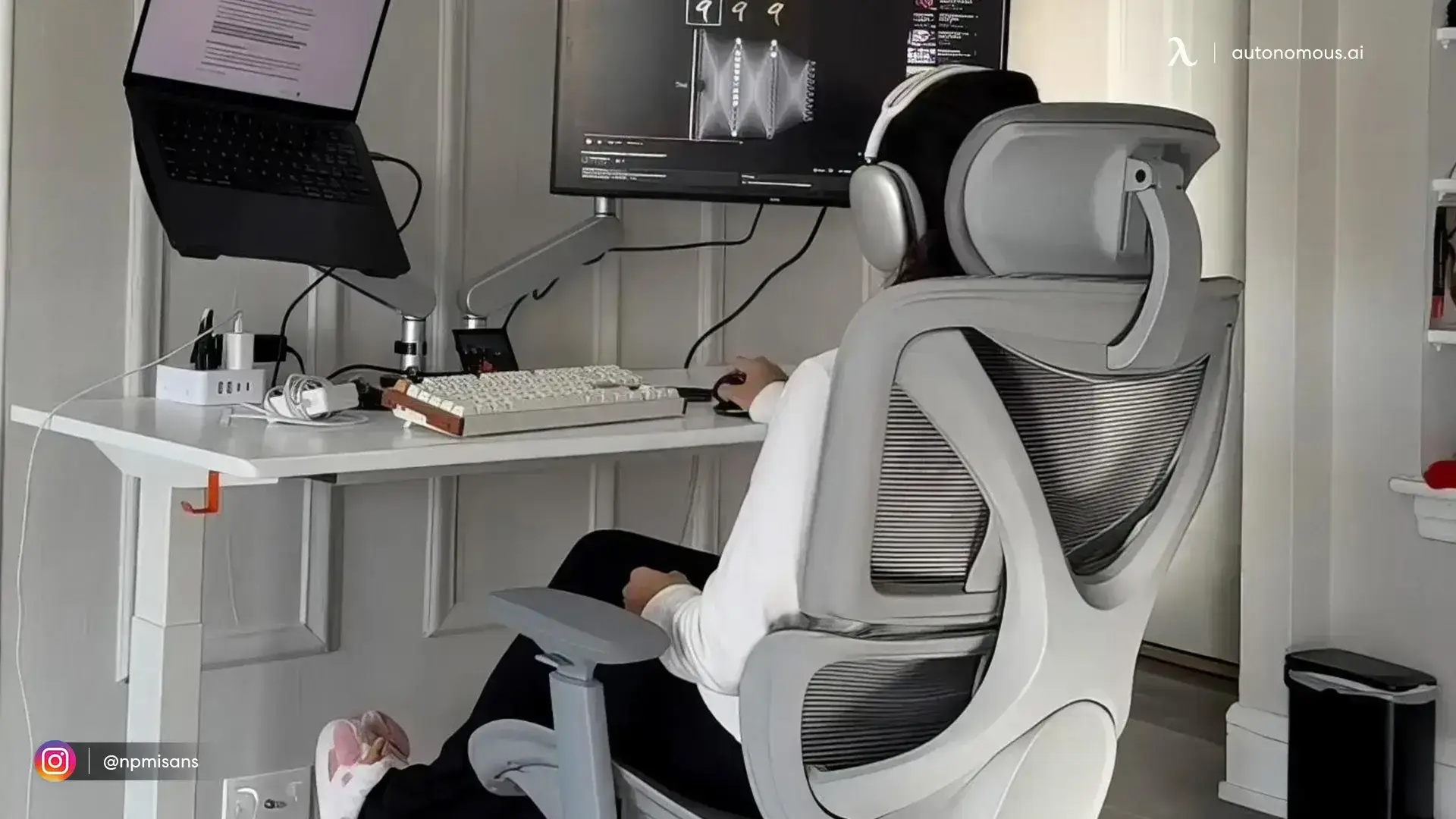 lack and white desk setup with a light grey ergonomic chair