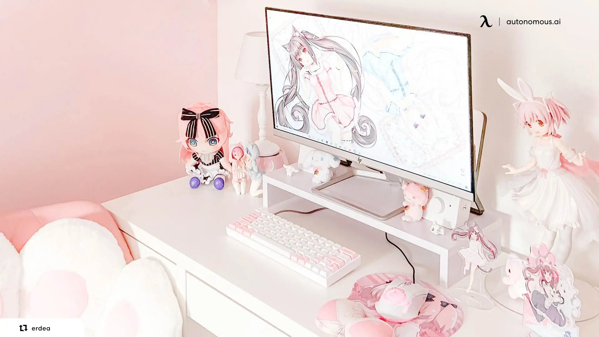 A cute anime gaming setup leans pink, white and lilac, with soft toys and figures