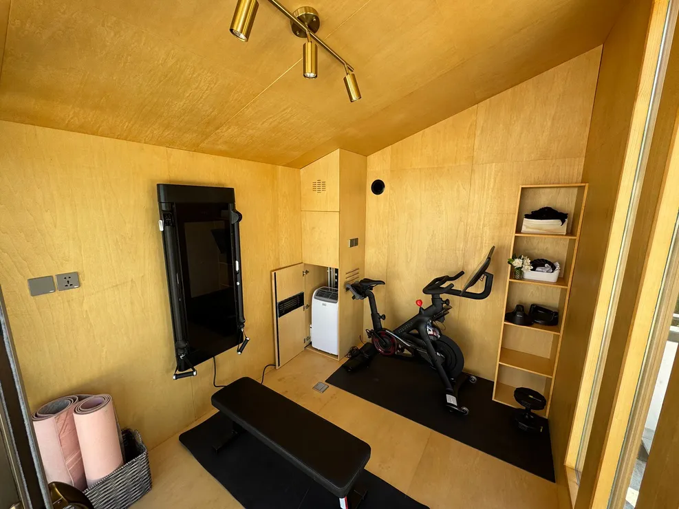 Home gym with an exercise bike inside a WorkPod