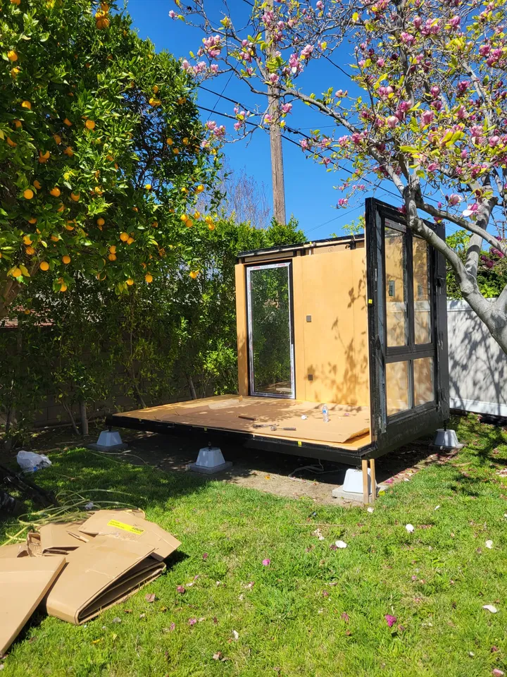 WorkPod being installed on a deck in a garden