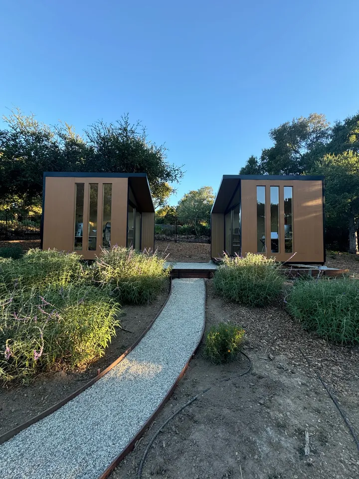 Two WorkPods at the end of a gravel garden path