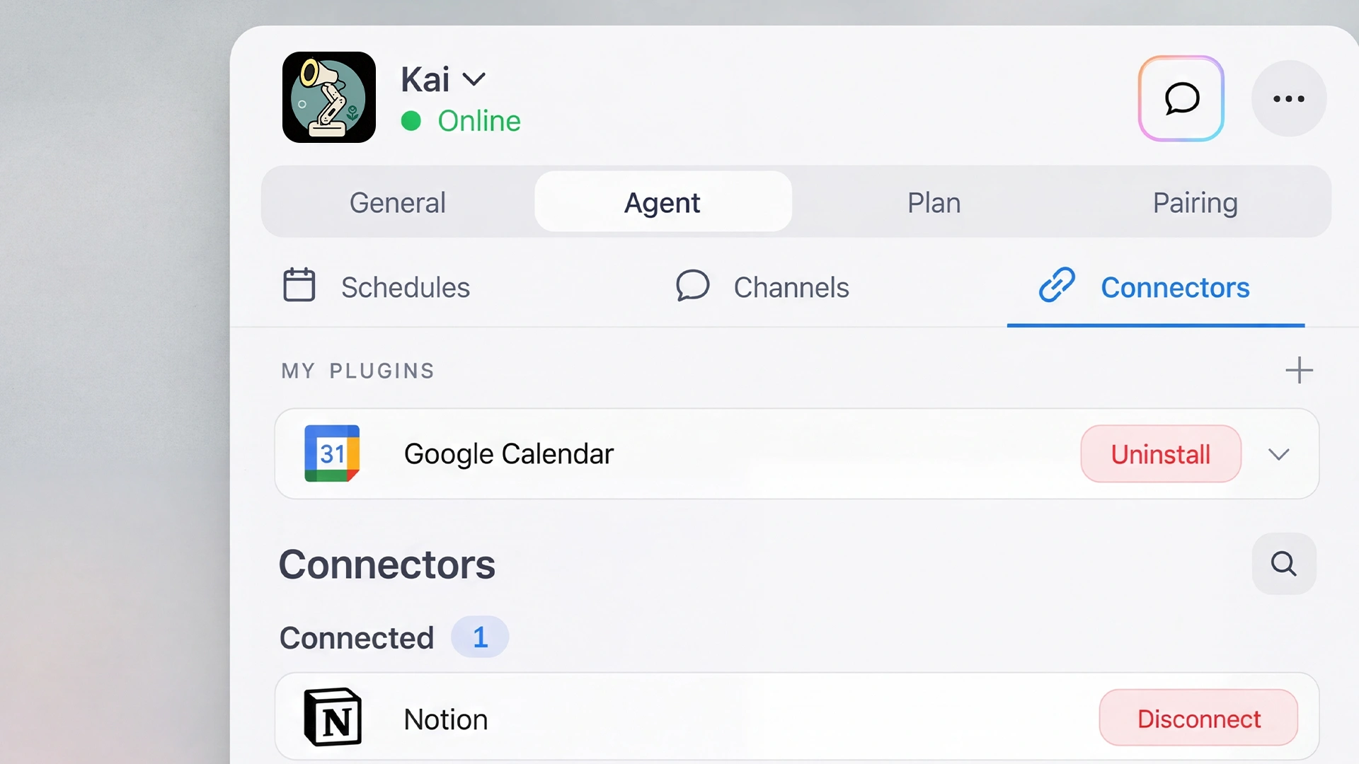 Lamp glowing on a desk beside a person coding at a monitor