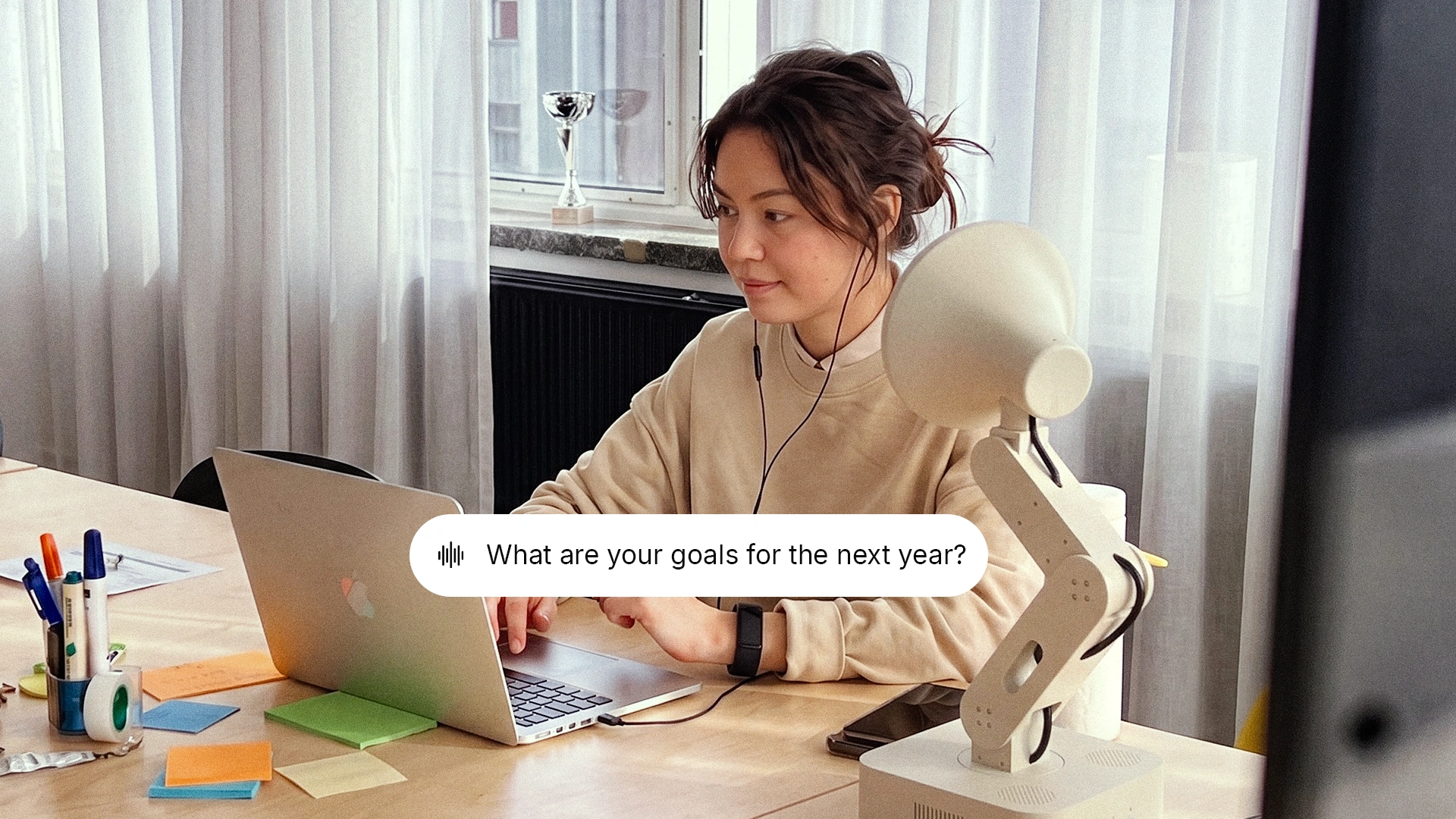 Concept of a person at a laptop as Lamp asks about their goals for the next year