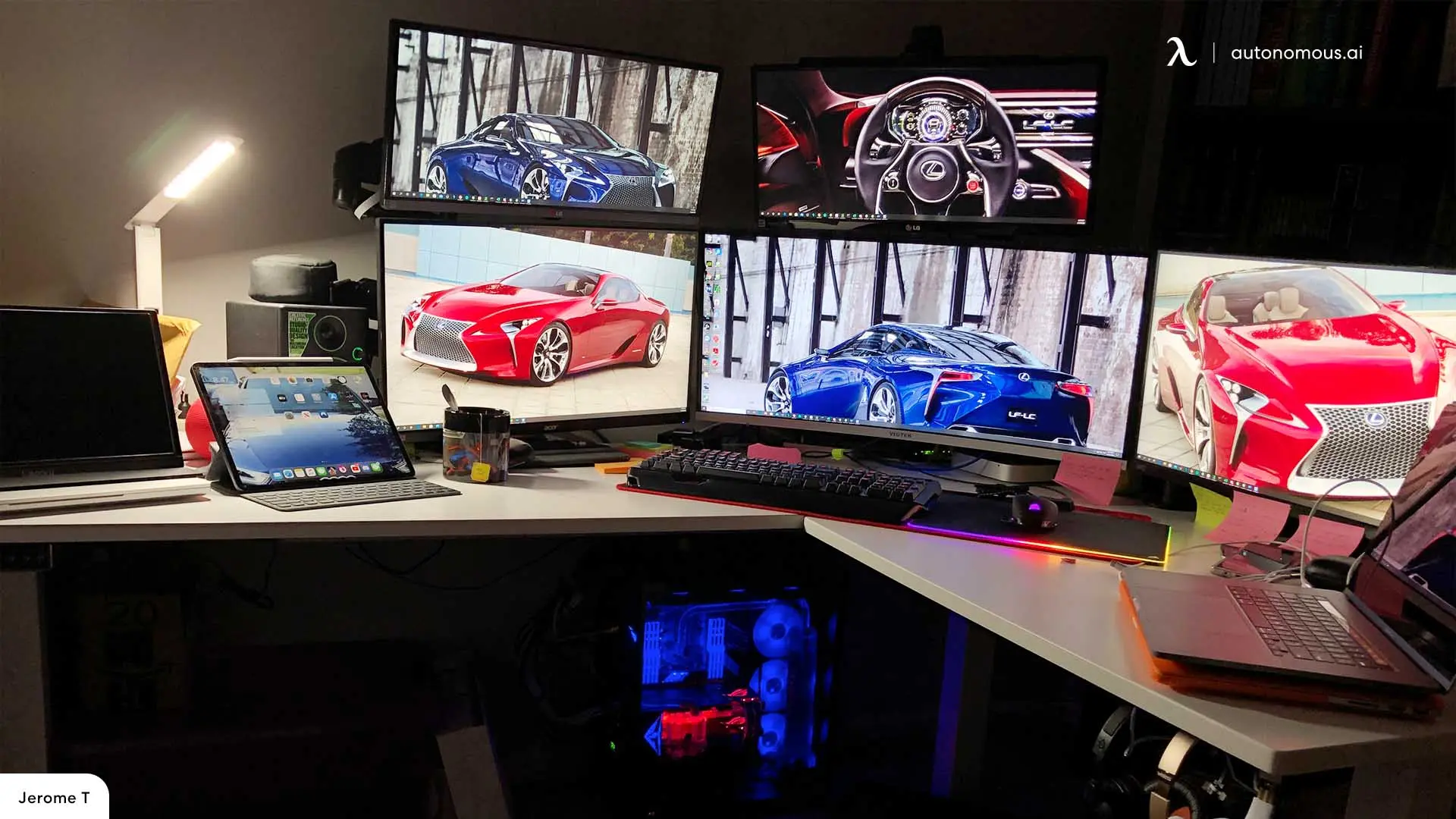 Multi-monitor workstation with a dense bank of screens and colorful dashboards