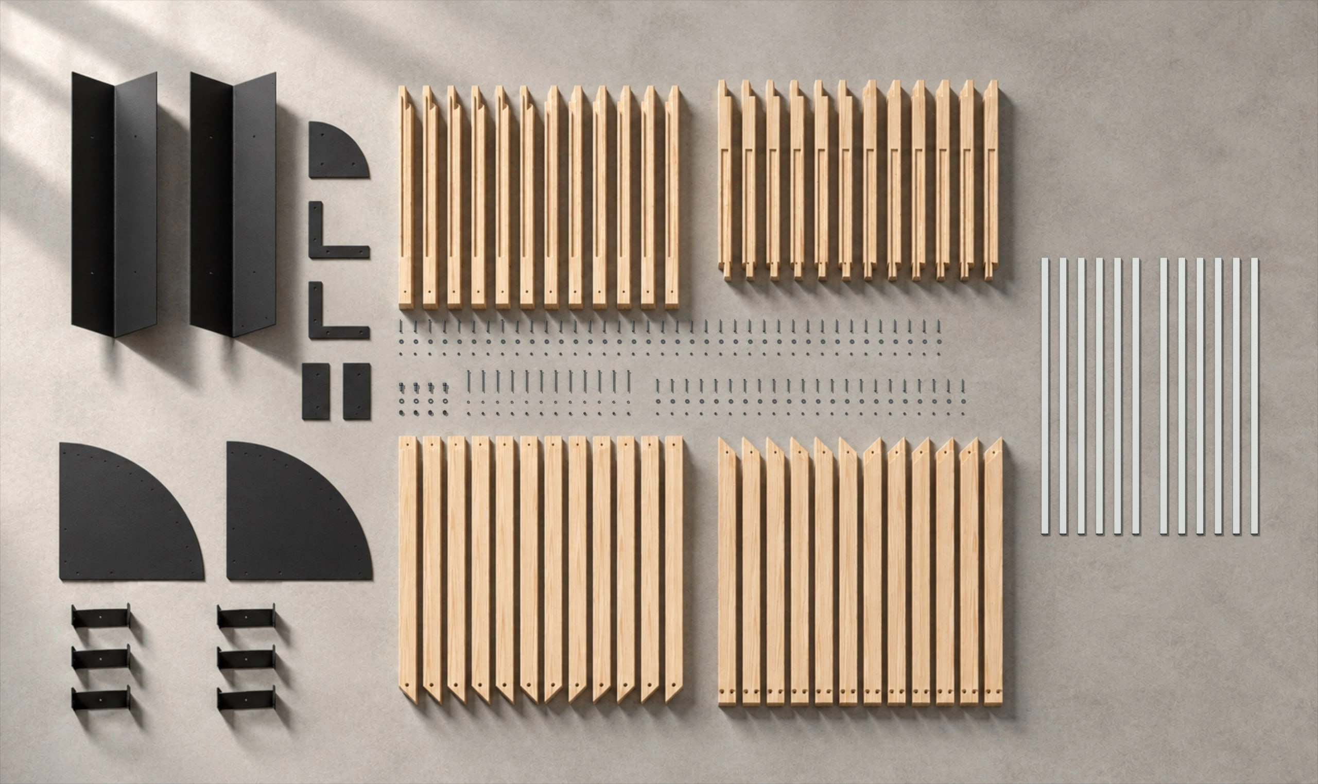 Every part of the kit laid out: black column and hub plate, wood posts and bent arms, brackets, four curved rail sections and a hardware box