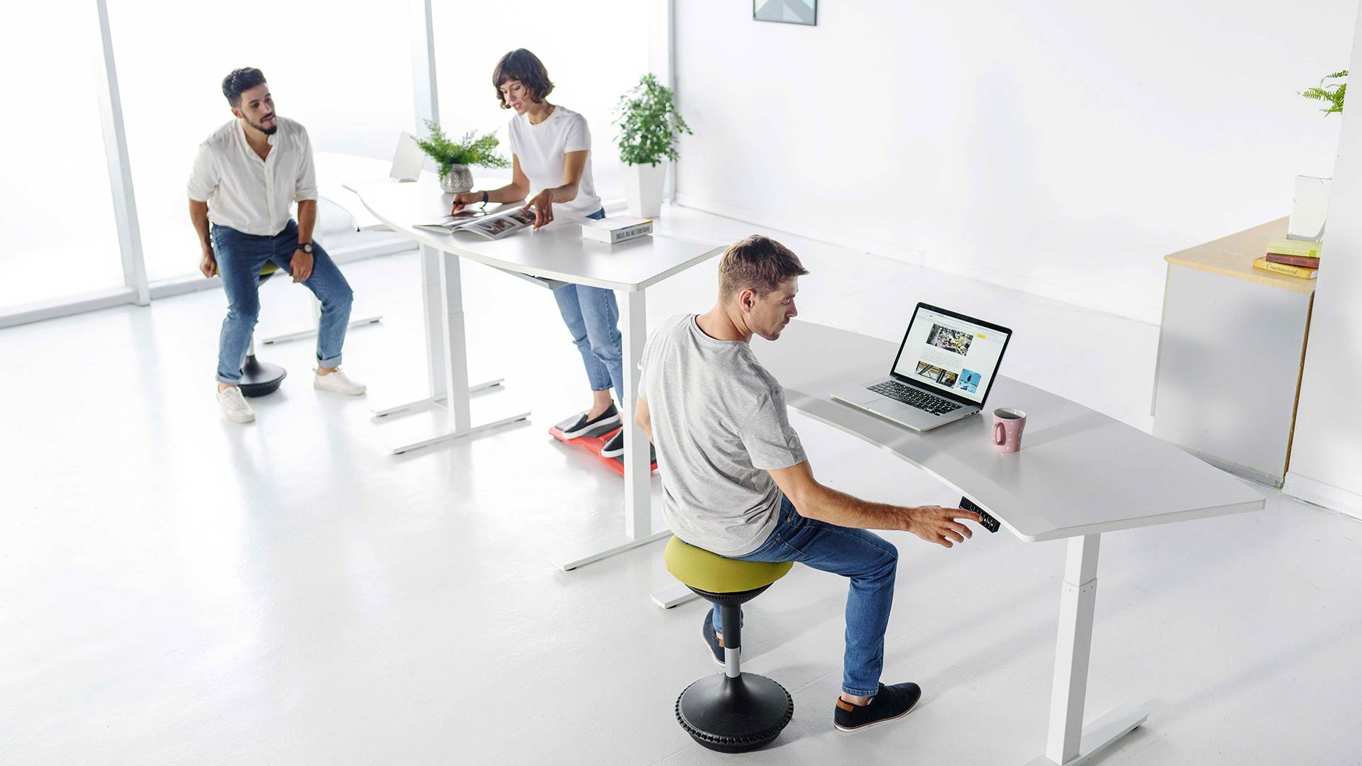 Modern office furniture featuring adjustable ergonomic active sitting stools.