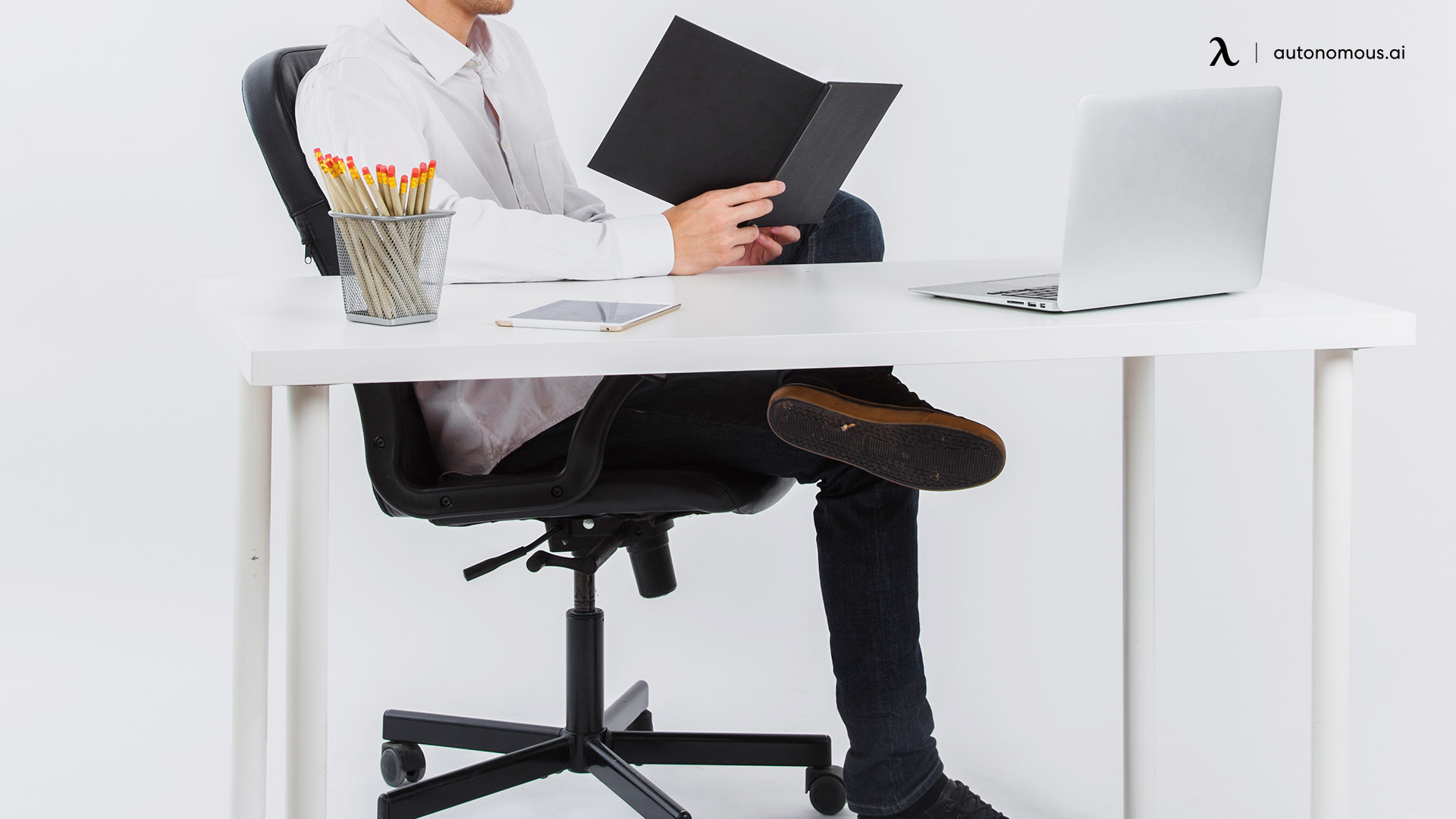 Sitting cross-legged on a chair