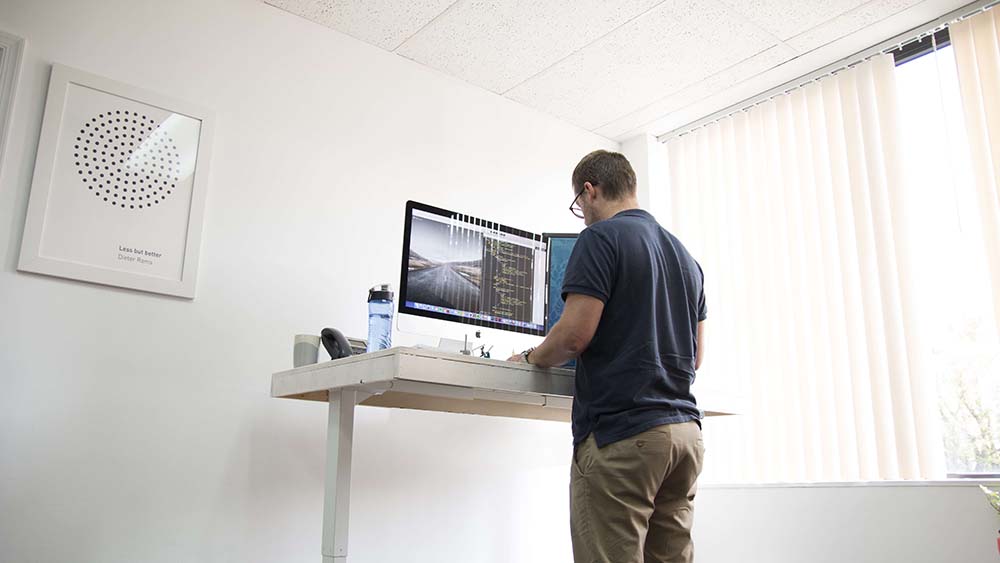 You're Probably Standing at Your Standing Desk Wrong. We Can Help