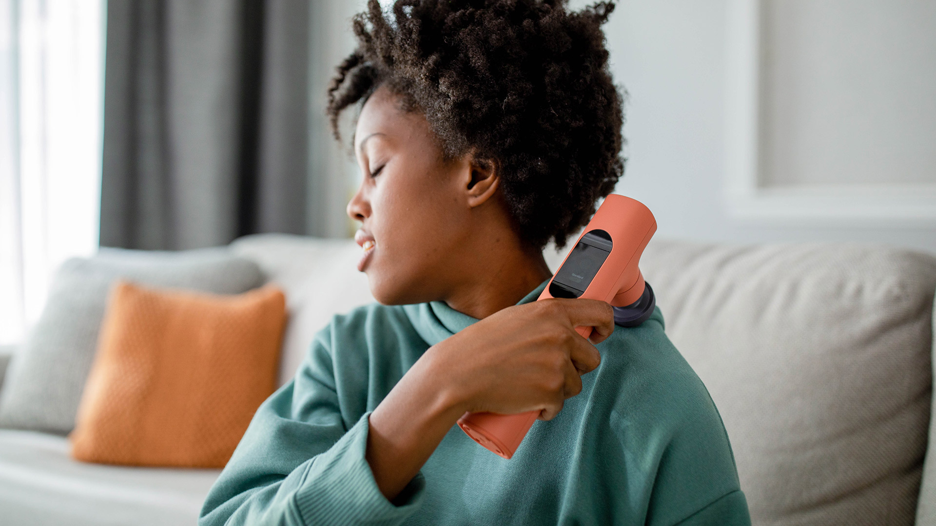 Smart Lyric Therapeutic Massager Looks Good Next to an iMac